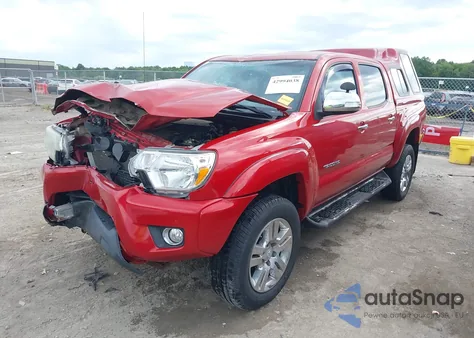 2015 Toyota Tacoma Base V6 z USA, uszkodzony, nr VIN 3TMLU4EN4FM167125